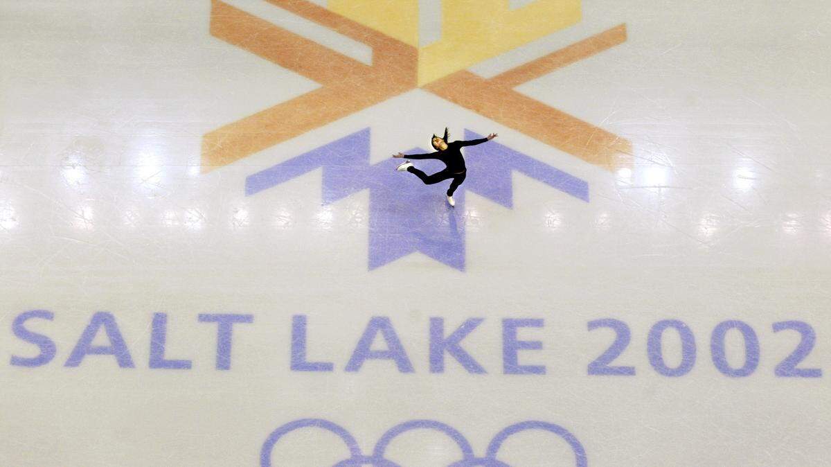 FILE - This Feb. 8, 2002, file photo, shows U.S. champion Michelle Kwan practicing for the women’s short program for the Winter Olympic Games at the Salt lake Ice Center in Salt Lake City. Salt Lake City got the green light to bid for an upcoming Winter Olympics most likely for 2030 in an attempt to bring the Games back to the city that hosted in 2002 and provided the backdrop for the U.S. winter team’s ascendance into an international powerhouse. (AP Photo/Doug Mills, file)