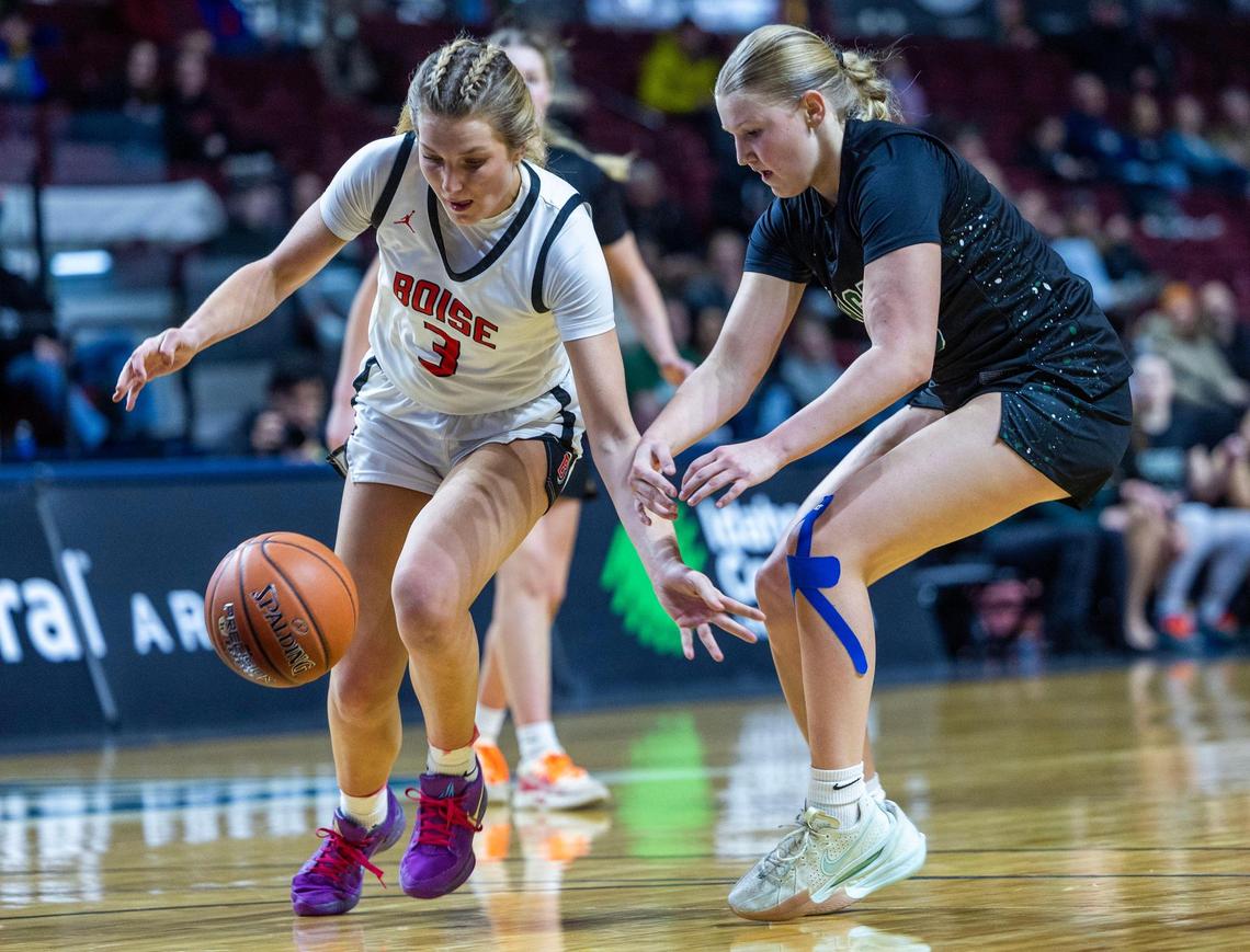 Boise senior Kaity Haan, left, steals the basketball from Eagle’s Berkley Jones at midcourt in the 6A District Three girls basketball championship game last week at Idaho Central Arena in Boise.