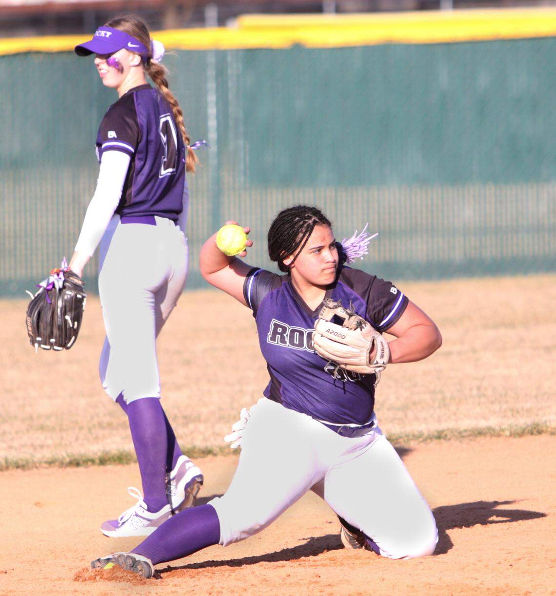 Rocky Mountain shortstop Lolo Walker fires a throw to first base during warmups between innings Tuesday at Rocky Mountain High.