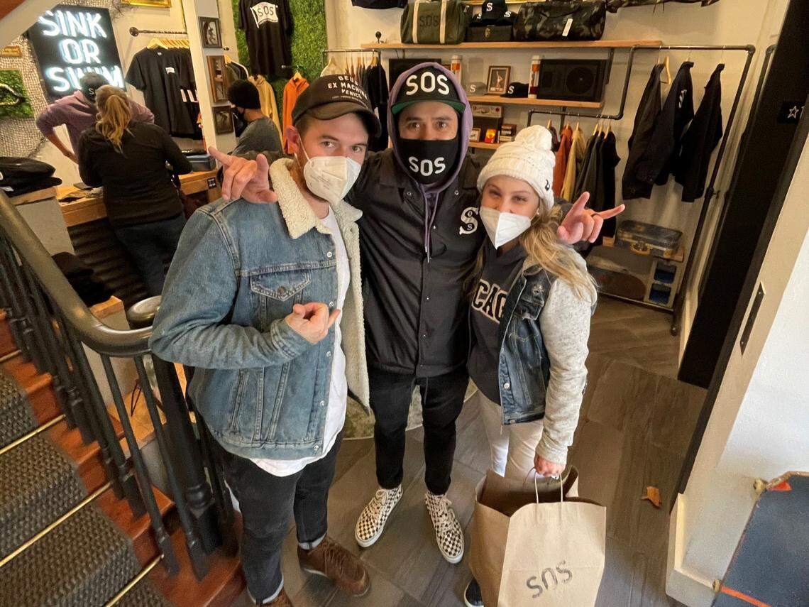Alex Moore, designer and co-owner Ian Hoey, and Courtney Moore inside the new SOS Apparel store at 104 S. Capitol Blvd. in Boise. Provided by Bradley Public Relations