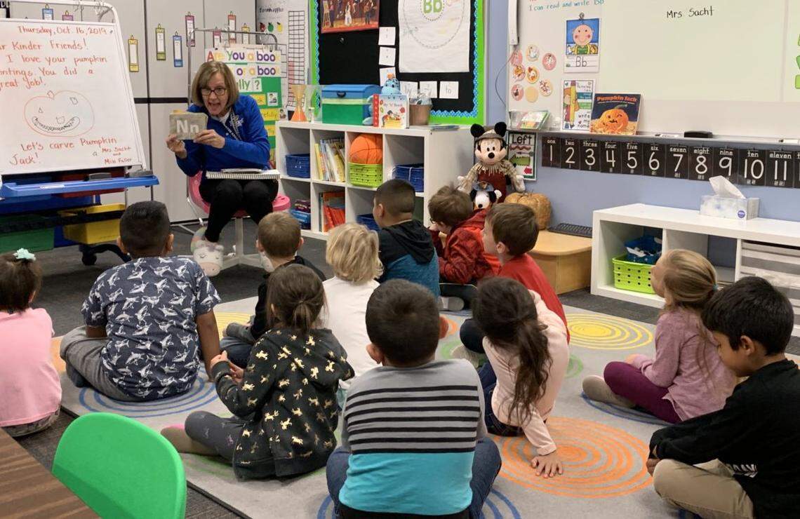 Notus Elementary School teacher DA Sacht works with kindergartners on a letters drill. Idaho senators approved a bill to provide optional full-day kindergarten.
