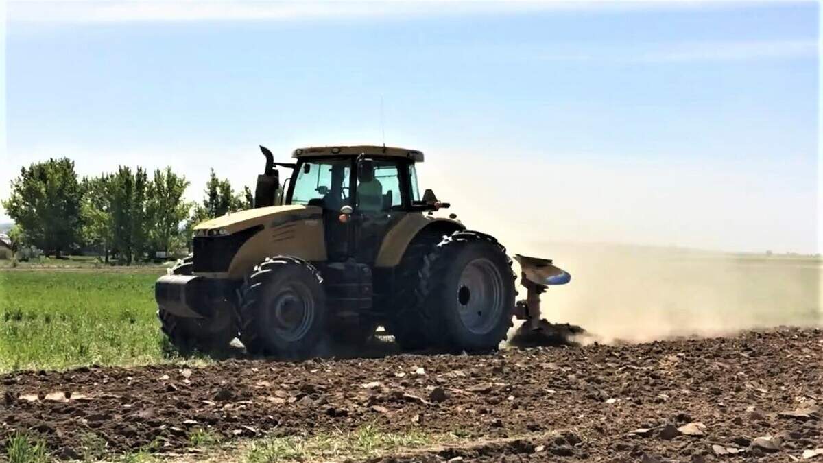 A farmer on a tractor prepares an agricultural field for planting west of Nampa. Housing developments have sprouted near the Deer Flat National Wildlife Refuge and elsewhere in the Nampa-Caldwell area, prompting concerns about the loss and preservation of farmland.