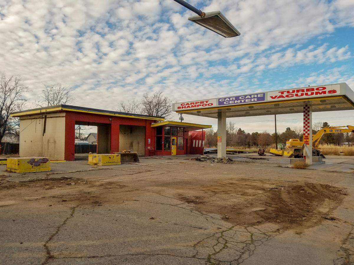 Demolition has started at 13 S. Latah St. The fuel-pump canopy will remain.
