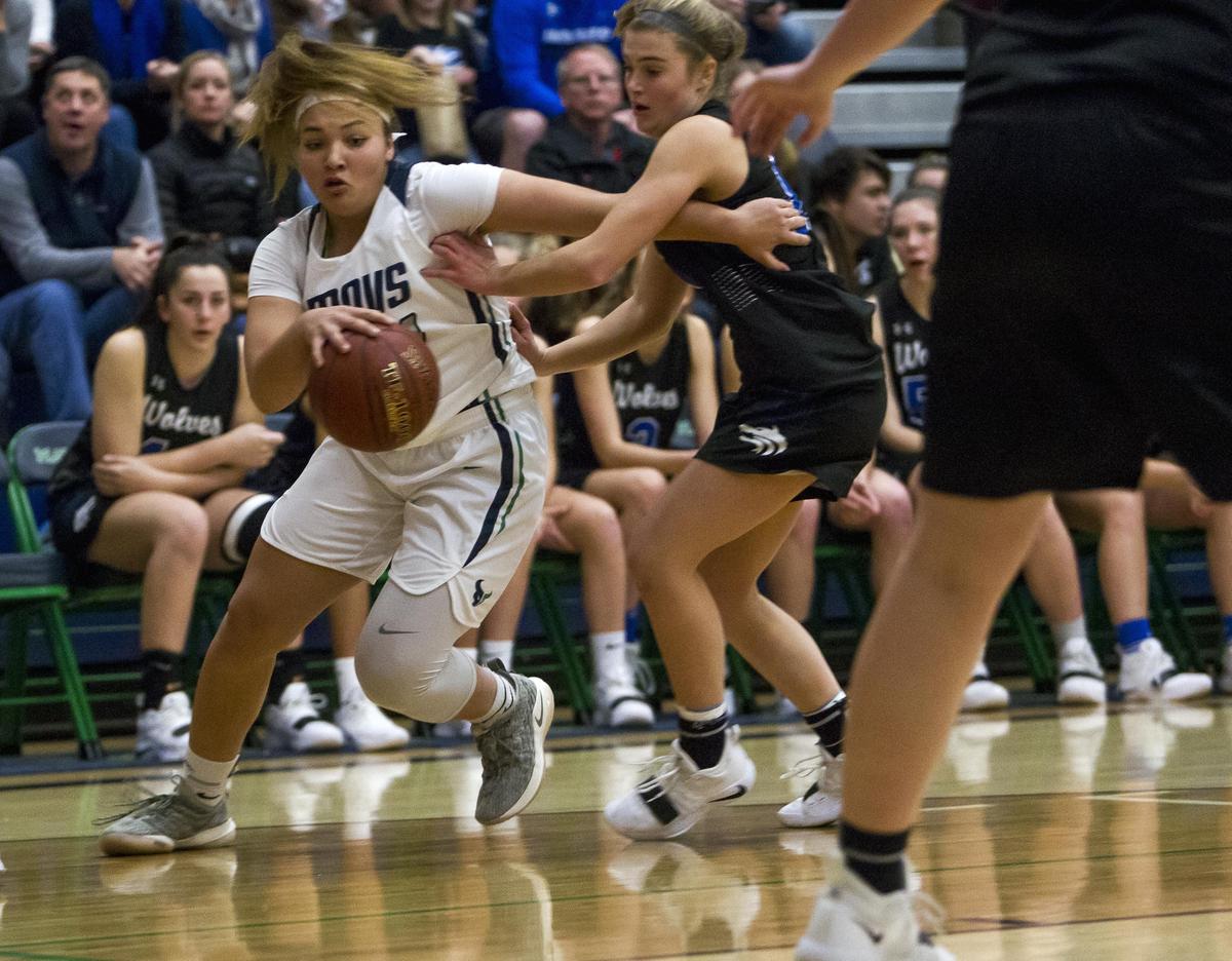 Mountain View guard Trinity Slocum eyes a lane to the basket last year against Timberline.