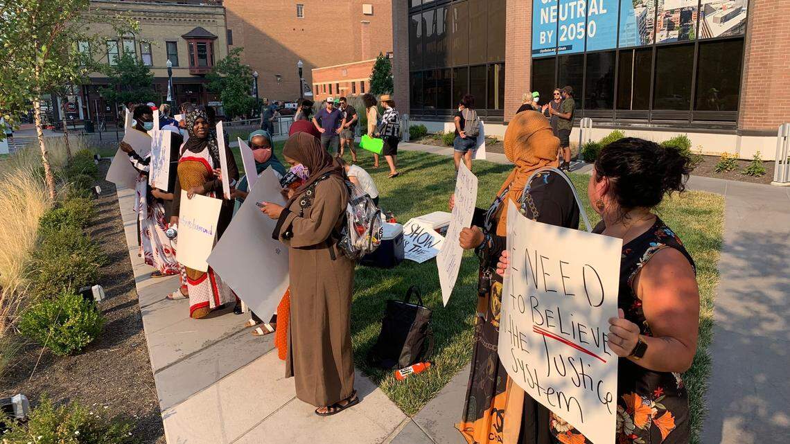 Members of the Somali Bantu community in Boise and supporters protest outside City Hall on Tuesday evening in response to a police shooting in late June.