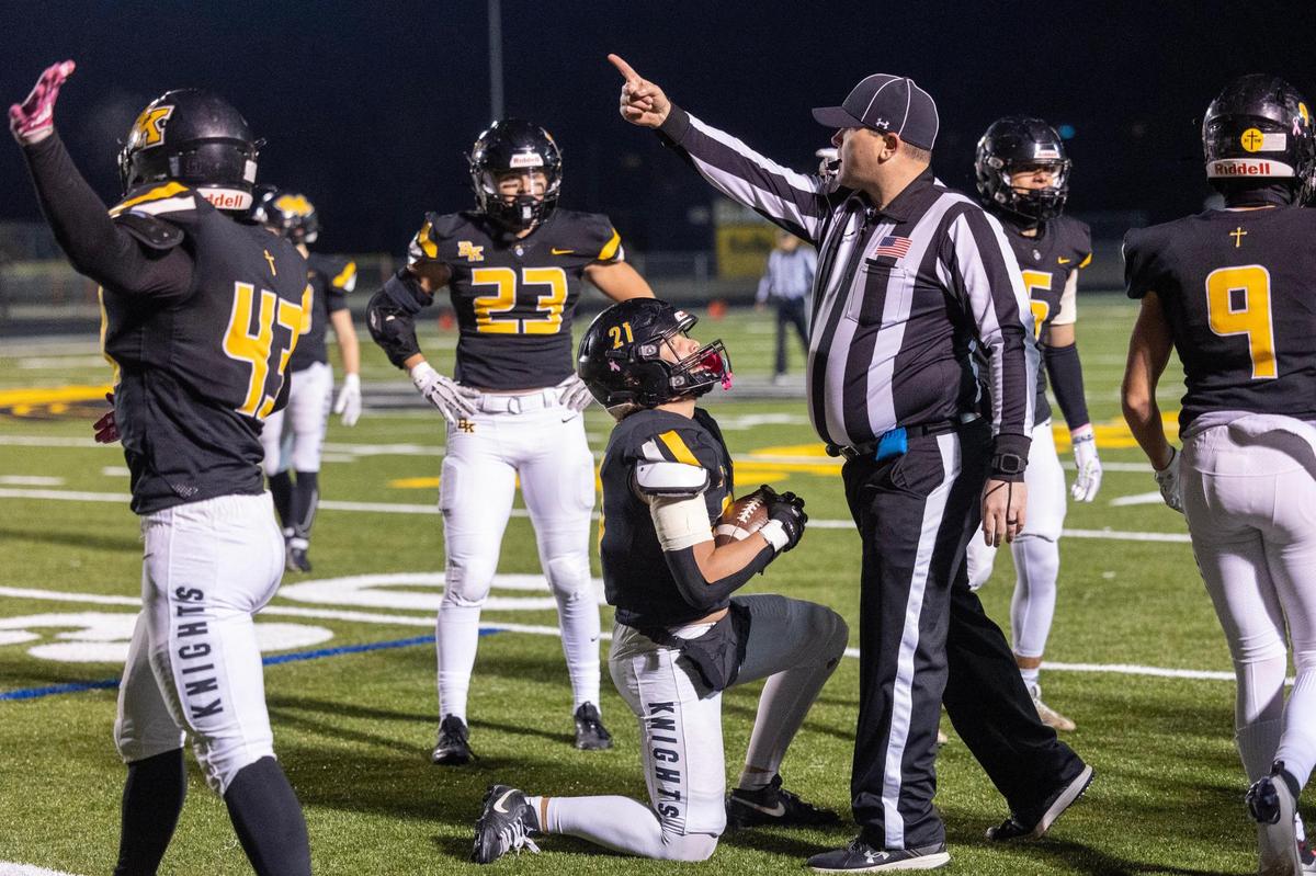 Bishop Kelly senior Trey Jorgensen waits for the official’s confirmation after snaring an interception last week against Pocatello. The Knights and their 4A-leading defense take on Hillcrest in the 4A state championship game at 7 p.m. Friday at Albertsons Stadium.
