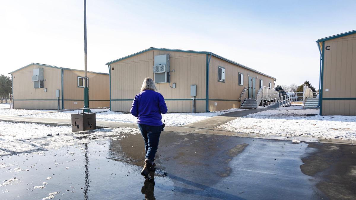Lakevue Elementary School co-principal Sarah Christensen walks to the portable classrooms where the school hosts all of its 4th graders.