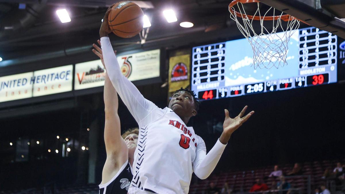 Hillcrest’s Isaac Davis pulls down a defensive rebound during last year 4A state tournament. Davis and the Knights finished as the unanimous No. 1-ranked team in 4A this season.