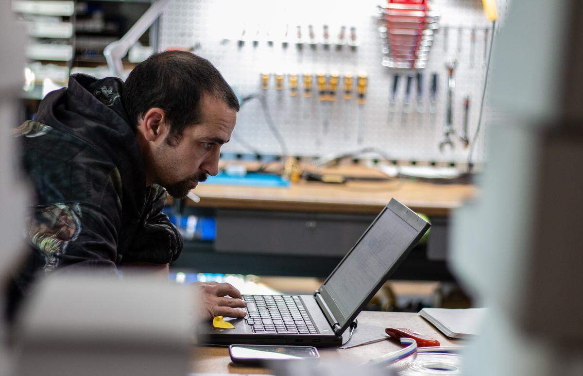 An employee at VersaBuilt studies his computer. The Boise robotics company is competing for graduates of the College of Western Idaho but is hoping to expand its talent pipeline.