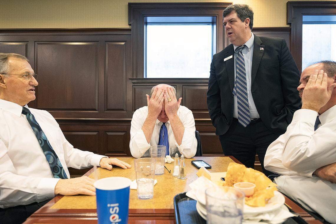 With their sport coats off, Reps. Gary Collins, R-Nampa, left; Mike Moyle, R-Star, at end of table; Sen. Jim Rice, R-Caldwell, standing; and Rep. Robert Anderst, R-Nampa, gather at a Taco Tuesday lunch in the cafeteria of the Capitol. Rice told the three representatives that language in a bill they wanted the Senate to pass does not work for him. Moyle reacts in frustration after having tried to find common ground with Rice, the chairman of the Senate Local Government and Taxation Committee, for much of the morning.