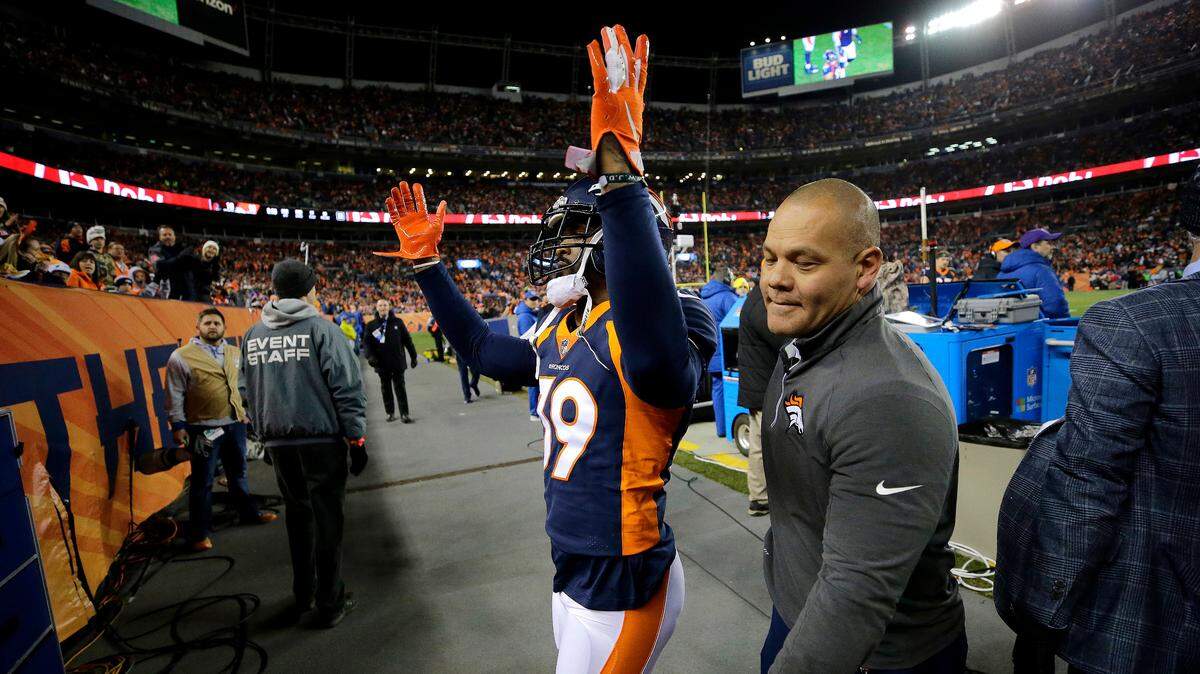 Denver Broncos cornerback Jamar Taylor waves to fans after being ejected in the third quarter against the Cleveland Browns on Dec. 15, 2018, in Denver.
