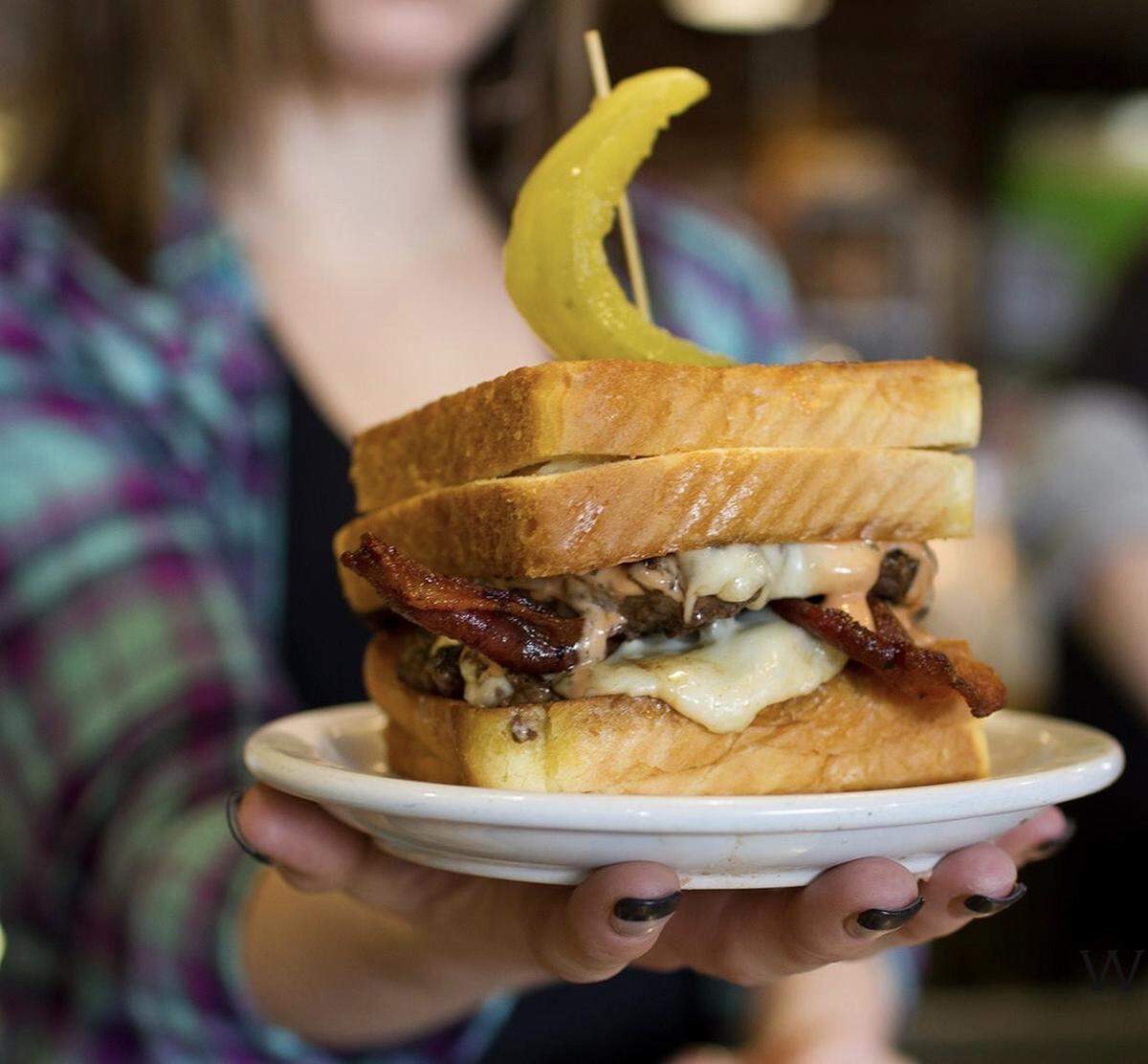 The Holy Cow burger is the restaurant’s “nod to the street burger,” co-owner Dylan Hutter says. “We keep it kind of ghetto fabulous on purpose.”