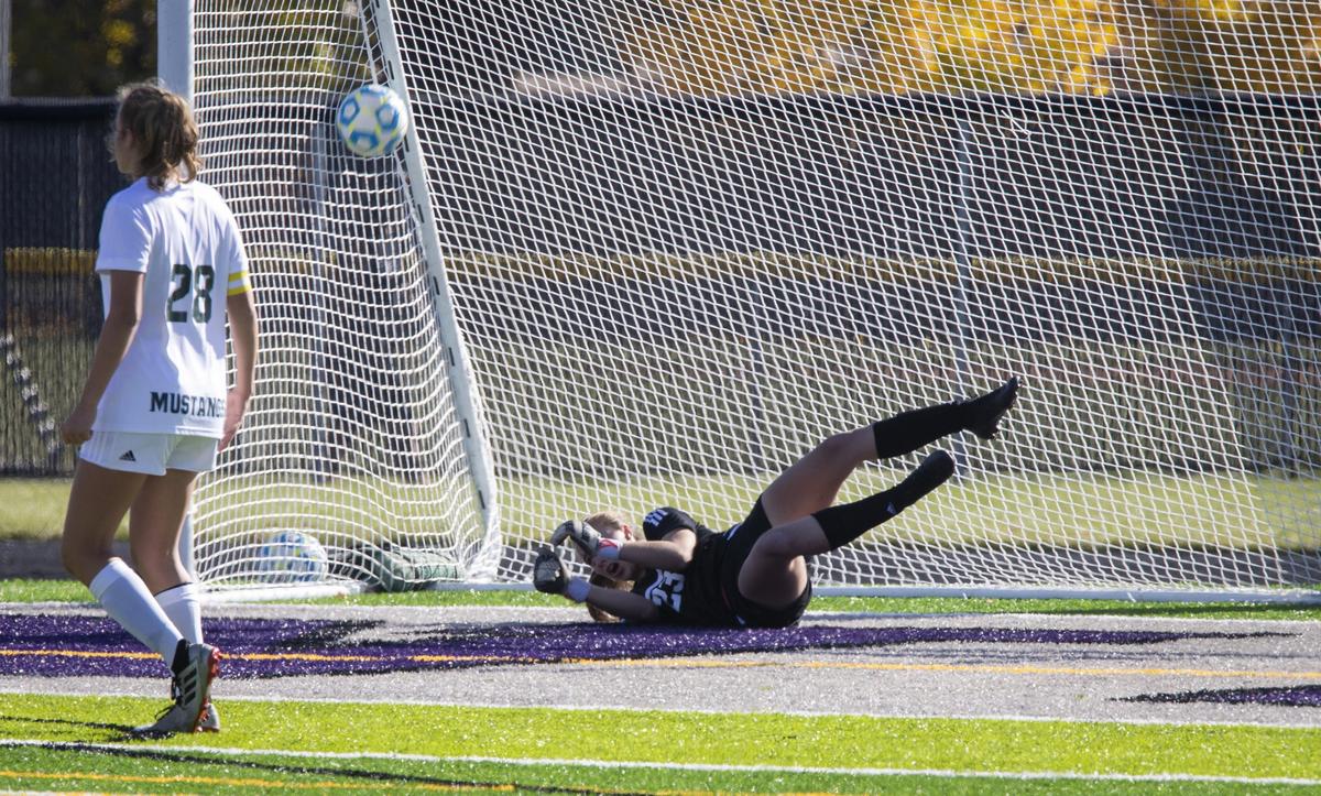 Eagle goalie Erin Cremer stops a shot from Boise’s Kendra McDaniel in the first round of the 5A girls soccer state tournament Thursday at Rocky Mountain High.