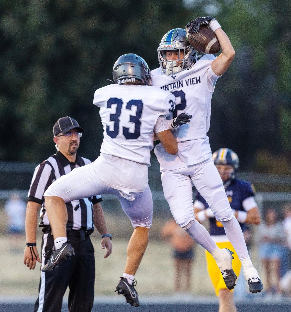 Mountain View wide receiver Kian Foy, right, celebrates a touchdown with teammate River McDonald in the first quarter of their 6A Southern Idaho Conference football game against Meridian.