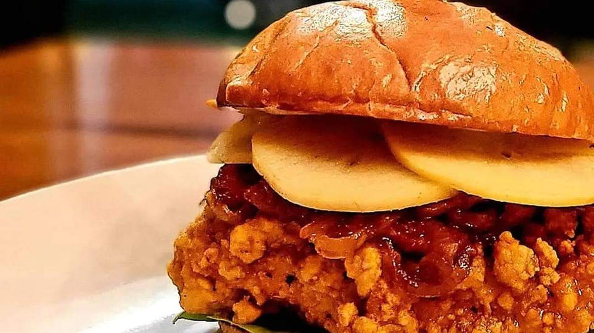 The Apple Whiskey Chicken sandwich at Izzy’s: “crispy fried chicken breast, whiskey glaze, jalapeno and ginger aioli, pickled apples, bacon and red onion jam on a toasted brioche bun.”