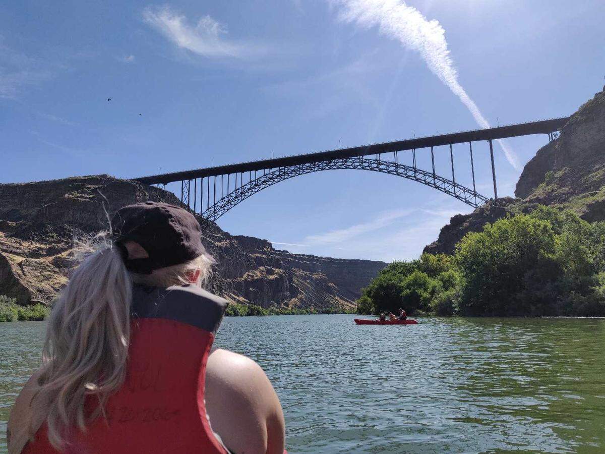 Outdoors reporter Nicole Blanchard paddles toward the Perrine Bridge on the Snake River on August 3, 2019. Kayakers can paddle upriver to reach Shoshone Falls, passing under the bridge and past Pillar Falls on the way.