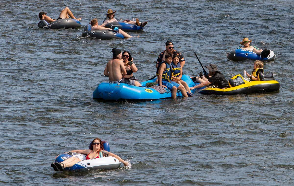 People float the Boise River in July 2022.
