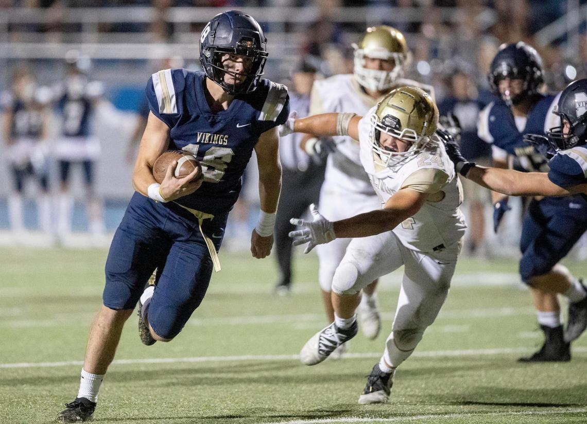 Middleton quarterback Ky McClure runs on a keeper against Vallivue’s defense on Sept. 17. The Vikings have made the state football playoffs seven years in a row.