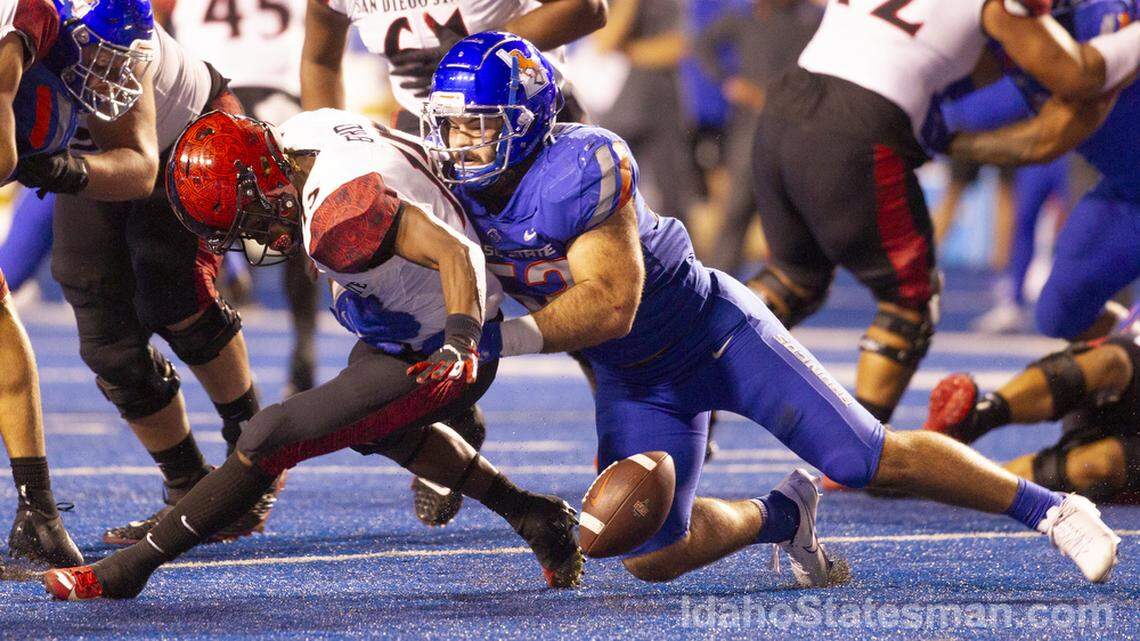 Boise State linebacker DJ Schramm forces a fumble in the second half of the Broncos’ 35-13 win over San Diego State on Sept. 30. Schramm leads the Broncos with 56 tackles this season.