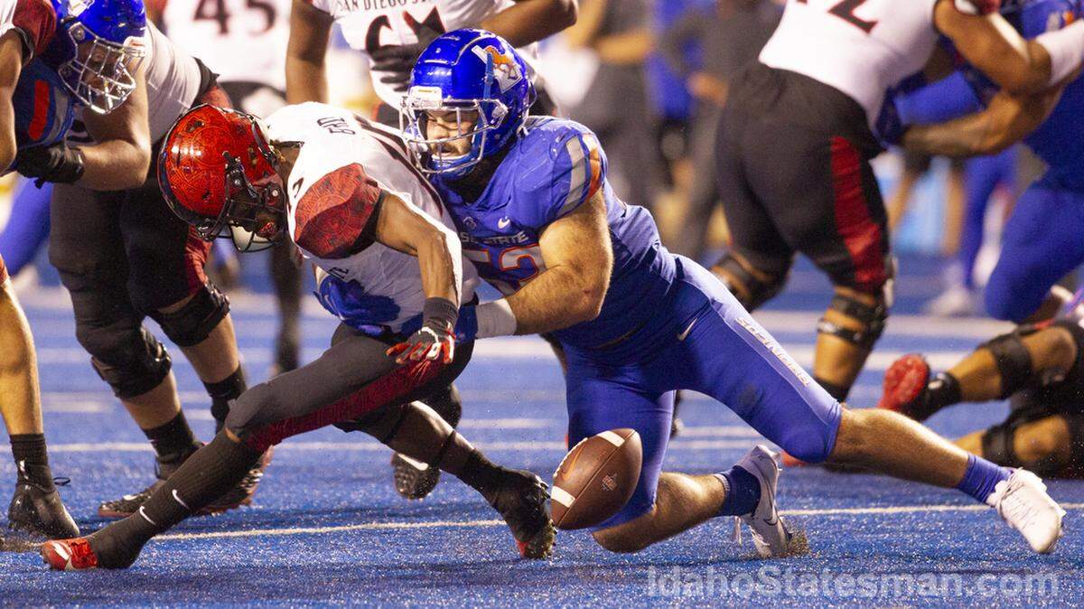 Boise State linebacker DJ Schramm forces a fumble in the second half of the Broncos’ 35-13 win over San Diego State on Sept. 30. Schramm leads the Broncos with 56 tackles this season.