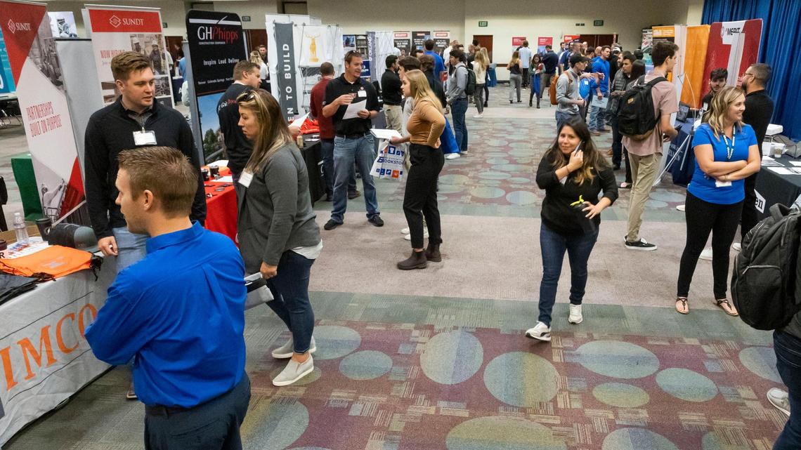 Students at Boise State University talk with construction company representatives during a job fair in the Jordan Ballroom at the Student Union Building, Thursday, Sept. 22, 2022. Construction management is an in-demand and lucrative job right now, with starting jobs paying in the neighborhood of $70,000 per year.