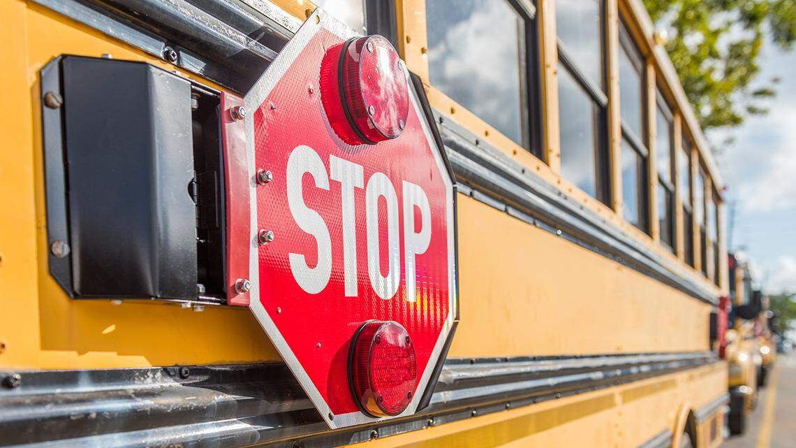 School bus line waiting for kids Getty Images | Royalty Free