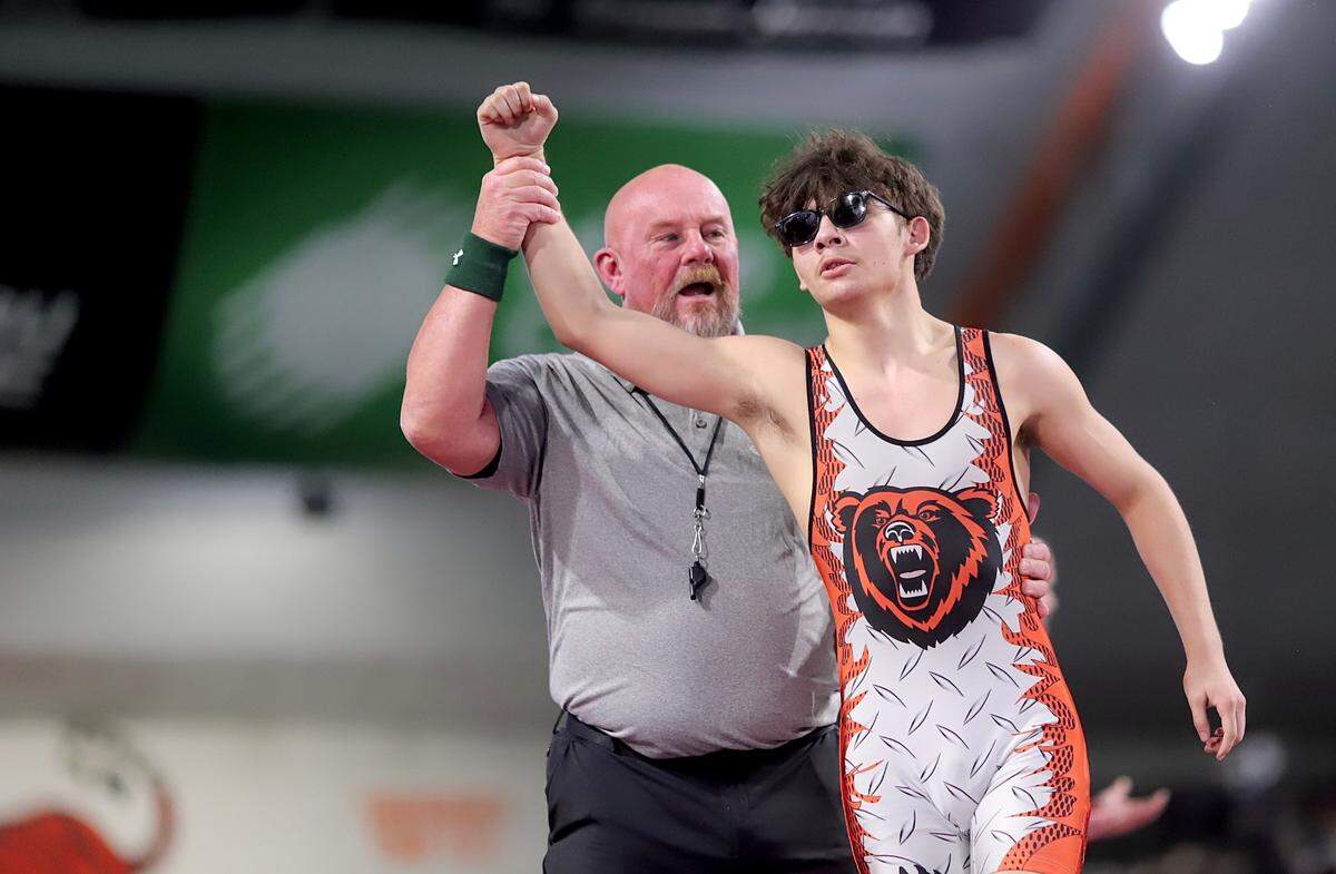 Fruitland junior Marcus Aleman gets his hand raised in victory Saturday following a first-period pin against Sugar-Salem’s Max Banta during the state championships in Pocatello.