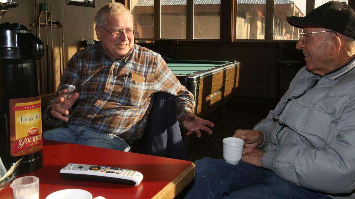 In this file photo from 2011, just after winning election as Kuna mayor, Greg Nelson, left, holds court at a back table at his Creekside Restaurant and Bar, talking here with Ray Smith, 87, who was a barber in Kuna for 42 years.