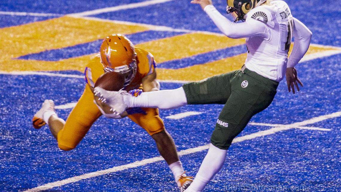 Boise State cornerback Avery Williams blocks a punt by Colorado State punter Ryan Stonehouse on Thursday at Albertsons Stadium. The punt was returned for a touchdown.