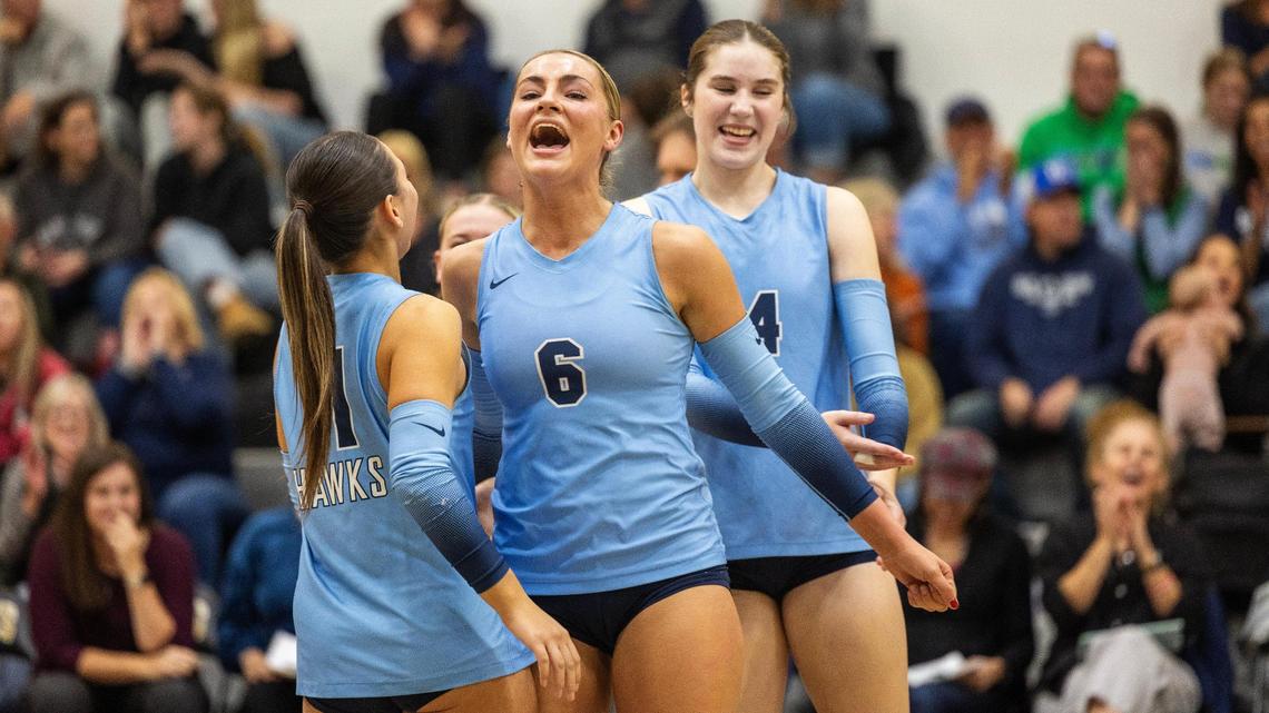 Skyview junior Bellamie Beus, center, reacts to a kill in a match against Owyhee in the 6A District Three Tournament volleyball championship game at Capital High School.