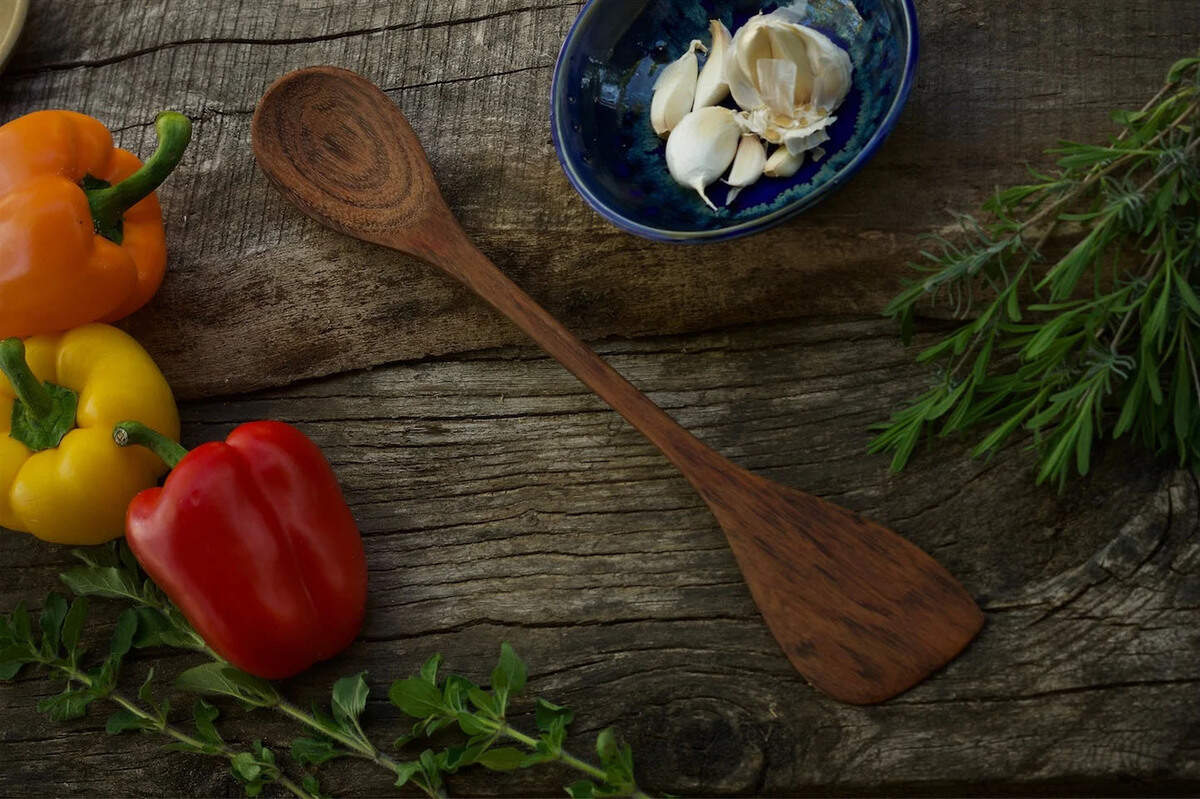 One of Mike and Meaghan Goulder’s hand-crafted utensils is the “Spoontula.” The Goulders have been selling their wooden utensils at the Capital City Public Market since 1996.
