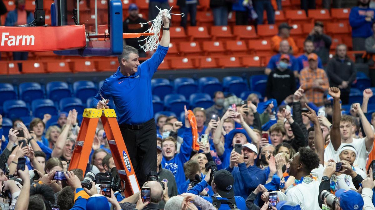 Boise State coach Leon Rice celebrates with fans after he and his team defeated Nevada 73-67 on March 1 at ExtraMile Arena in Boise. The win clinched the first outright Mountain West men’s basketball championship for Boise State.