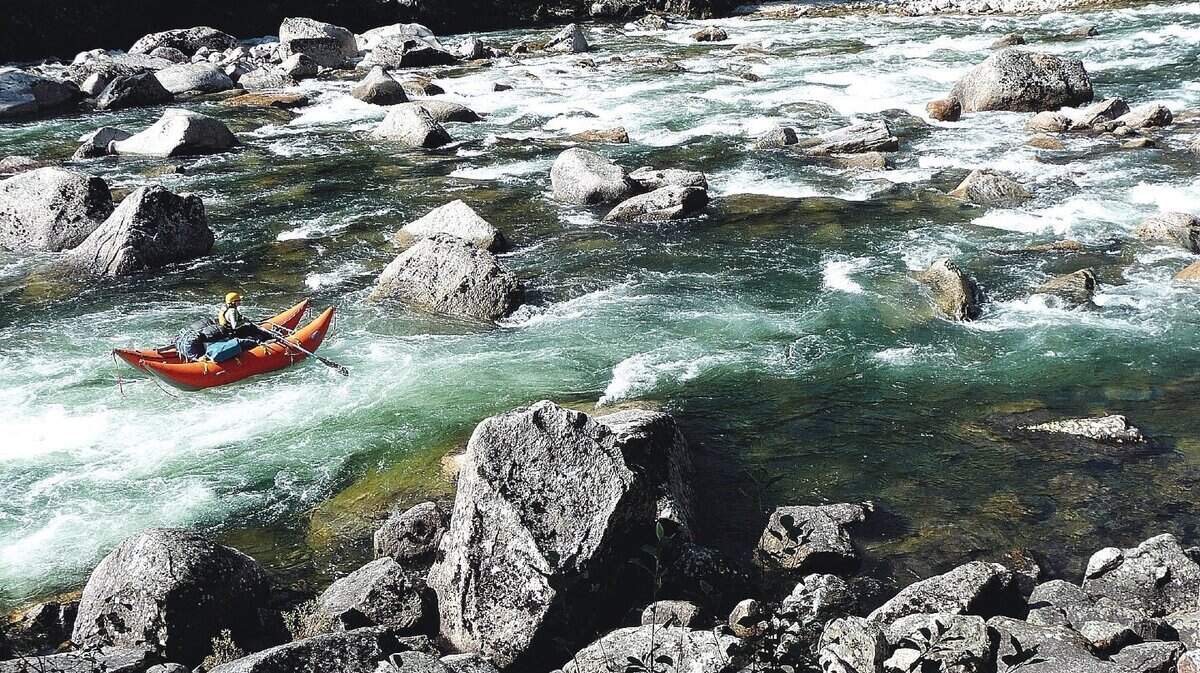 A rafter runs through Ladle Rapids on the Selway River in this 2013 file photo. Two rafters died during a whitewater trip on the Selway last weekend, according to the Idaho County Sheriff’s Department.