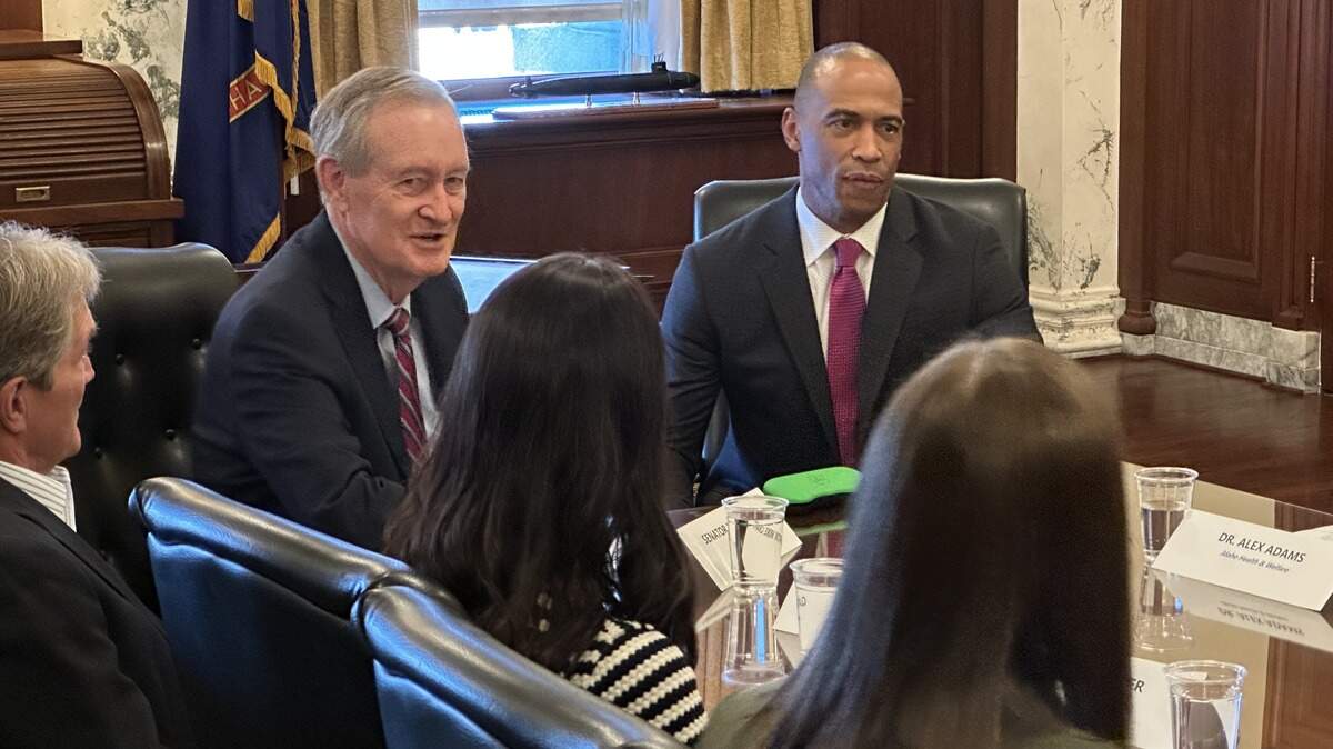 U.S. Sen. Mike Crapo, R-Idaho, left, and U.S. Housing and Urban Development Secretary Scott Turner speak to a roundtable on affordable housing Tuesday, Aug. 19, 2025, in the governor’s ceremonial office at the state Capitol in Boise.