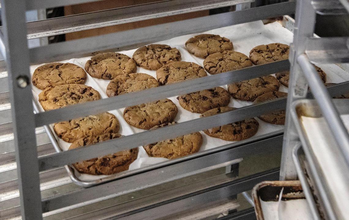Cookies cool on a rack in the kitchen at Wildflour Bakery.