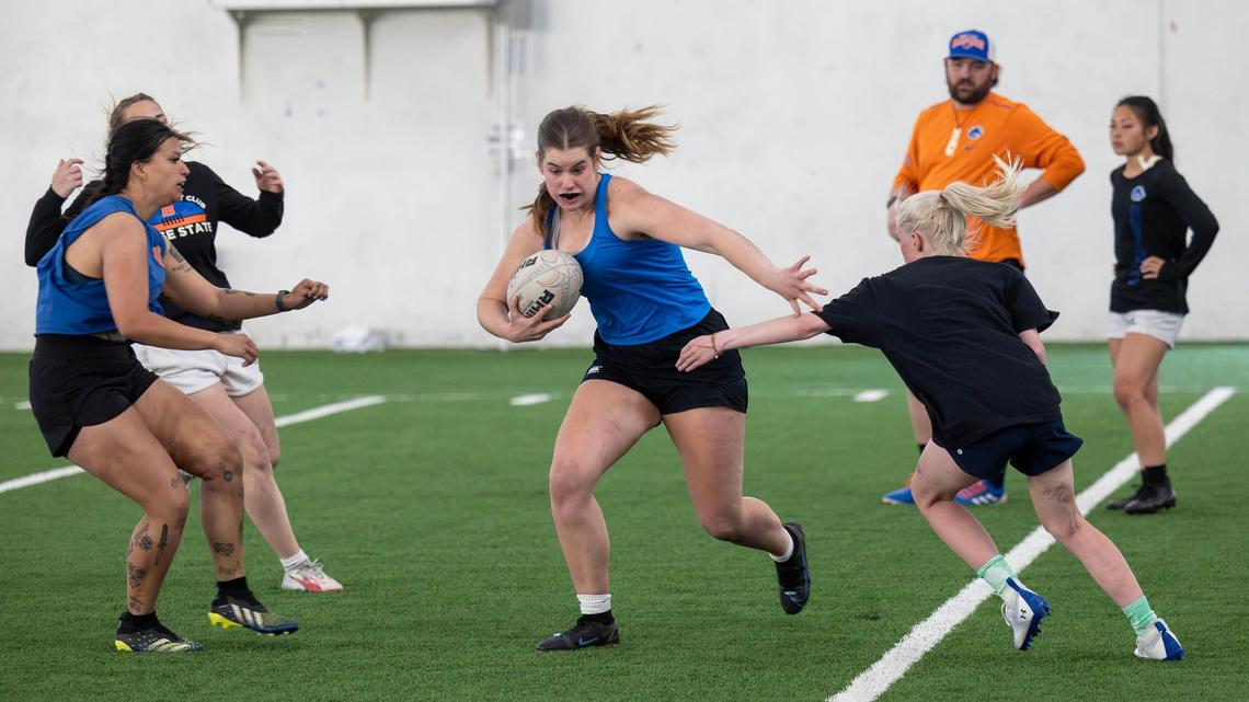 Colleen Van Note plays the second row position for the Boise State women’s rugby team. The team runs drills during a practice Wednesday night at Caven-Williams Sports Complex in Boise.