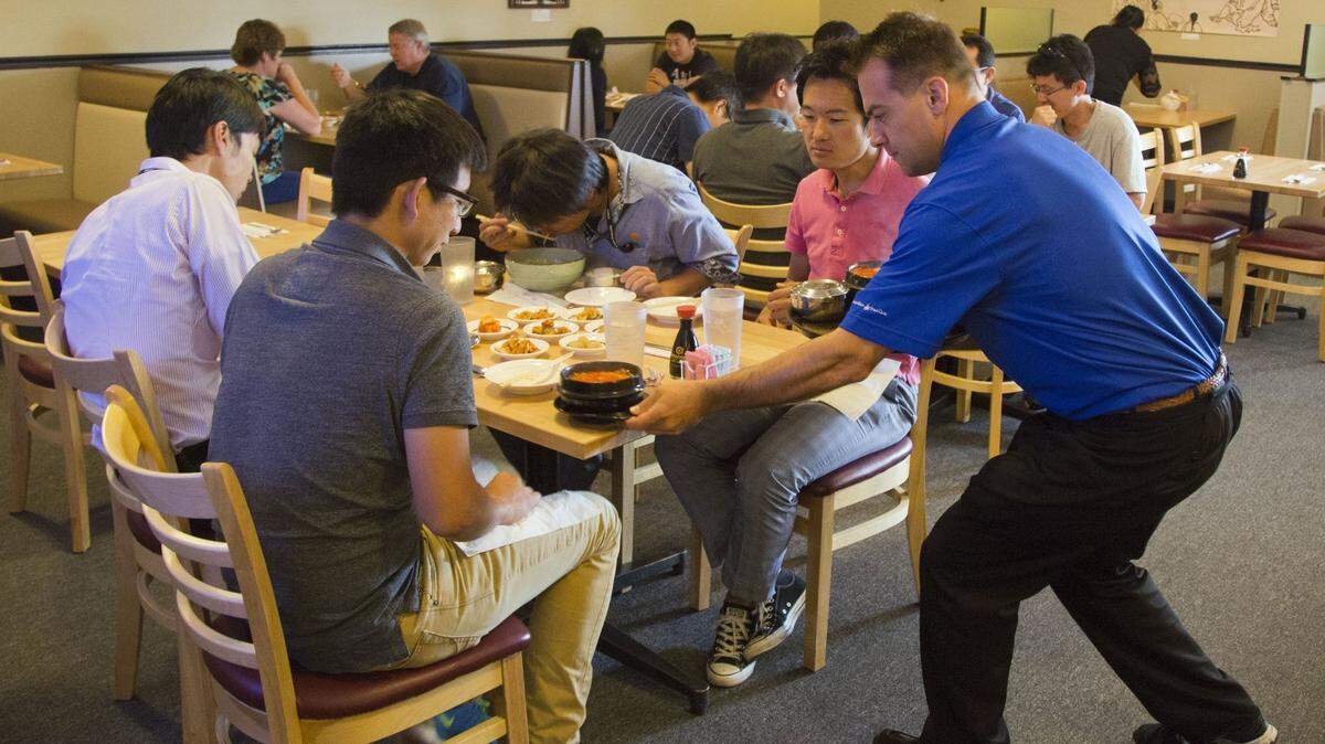 In this 2015 photo, diners are served at Gangnam, formerly Wasabi, after it debuted on Orchard Street in Boise.