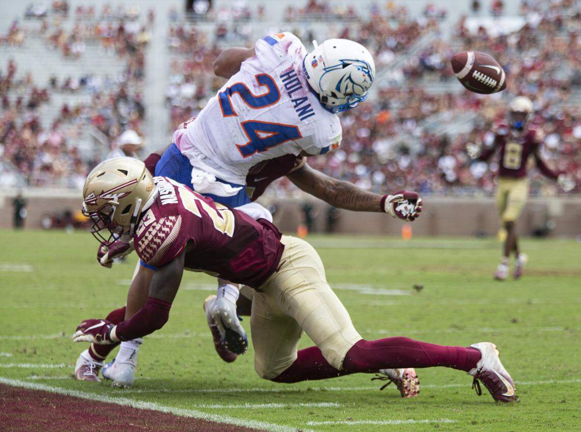 Boise State running back George Holani fumbles as he is hit by Florida State defensive back Hamsah Nasirildeen in the season opener in Tallahassee, Florida. The Broncos recovered the fumble and scored the go-ahead touchdown two plays later.