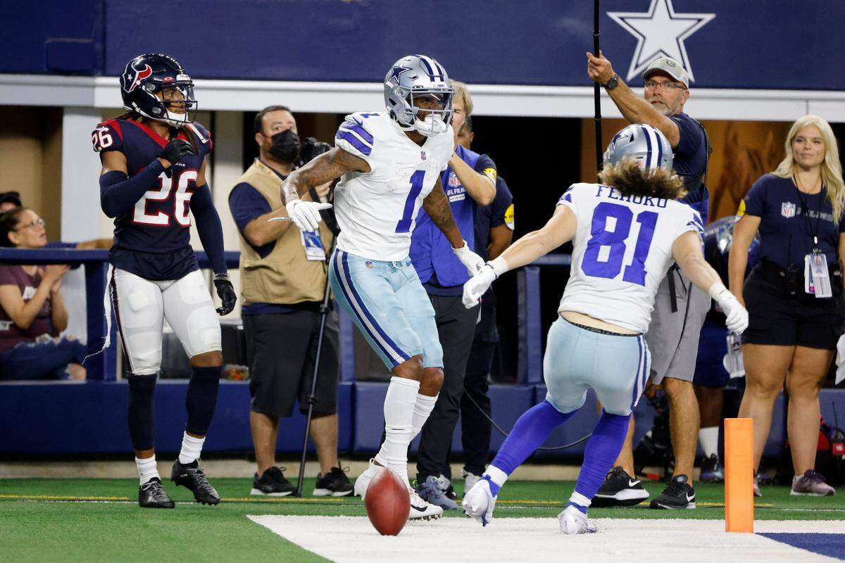 Houston Texans cornerback Vernon Hargreaves III, far left, walks past as Dallas Cowboys wide receiver Cedrick Wilson, center, and wide receiver Simi Fehoko celebrate Wilson’s touchdown catch in the first half of a preseason NFL football game Aug. 21 in Arlington, Texas.