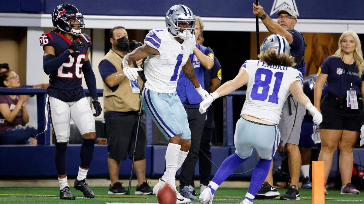 Houston Texans cornerback Vernon Hargreaves III, far left, walks past as Dallas Cowboys wide receiver Cedrick Wilson, center, and wide receiver Simi Fehoko celebrate Wilson’s touchdown catch in the first half of a preseason NFL game in Arlington, Texas, on Saturday.