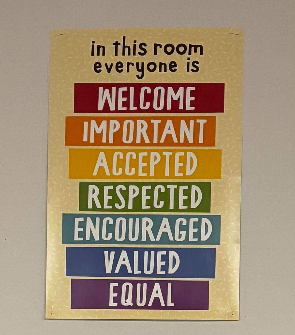 Sarah Inama has had this sign hanging in her classroom for four years. Inama said she was asked to remove it, along with another sign, also displaying a welcoming message.