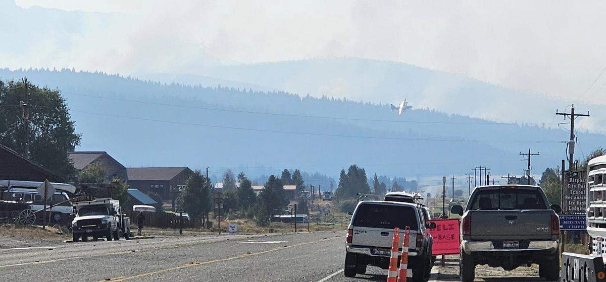 An aerial firefighting aircraft was seen from downtown Stanley.