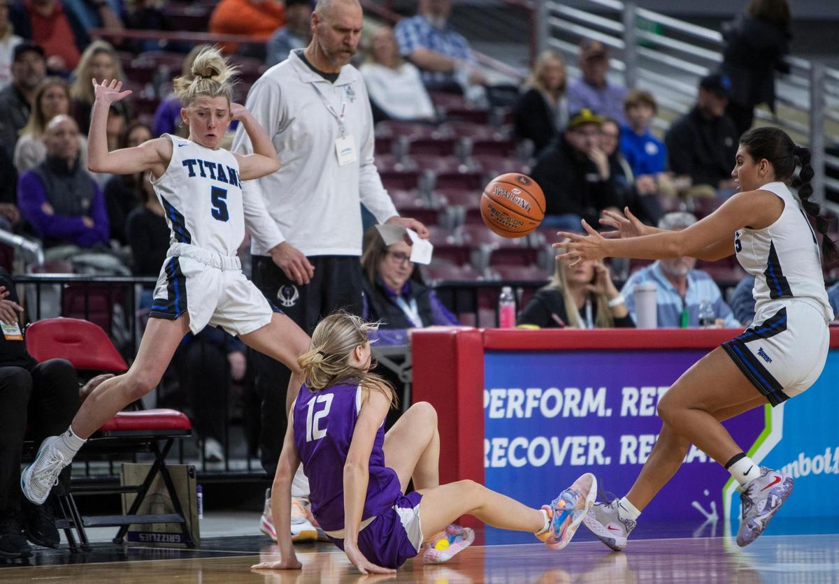 Rocky Mountain guard Averee Osterhout is pressured by Carly Stenquist (5) and Marley Spencer in front of the Grizzlies’ bench Thursday.