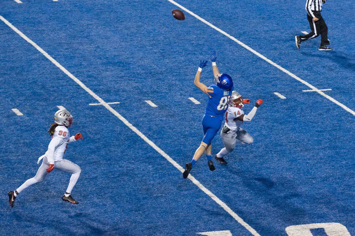 Boise State wide receiver Austin Bolt goes up for a pass during the Broncos’ 37-0 win over New Mexico last season.