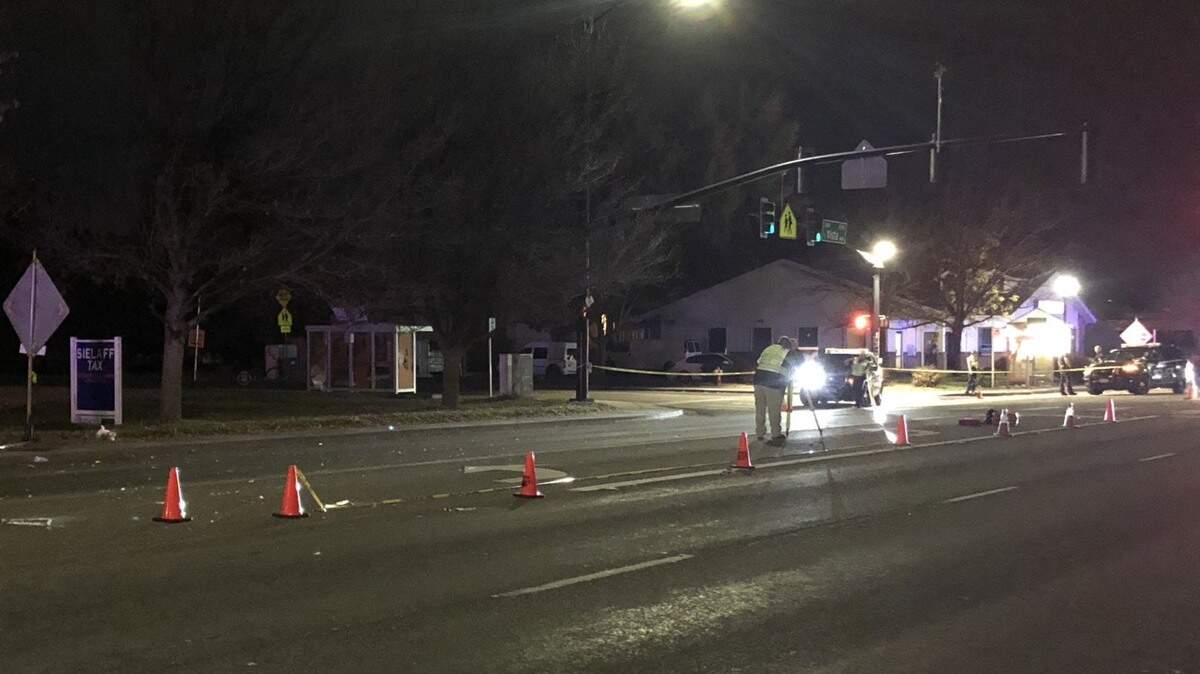 Crash reconstructionists take measurements at the scene of where a car struck and killed a pedestrian Wednesday night, Oct. 24, 2018. This view is from the north side of Targee Street at the intersection with Vista Avenue in Boise.