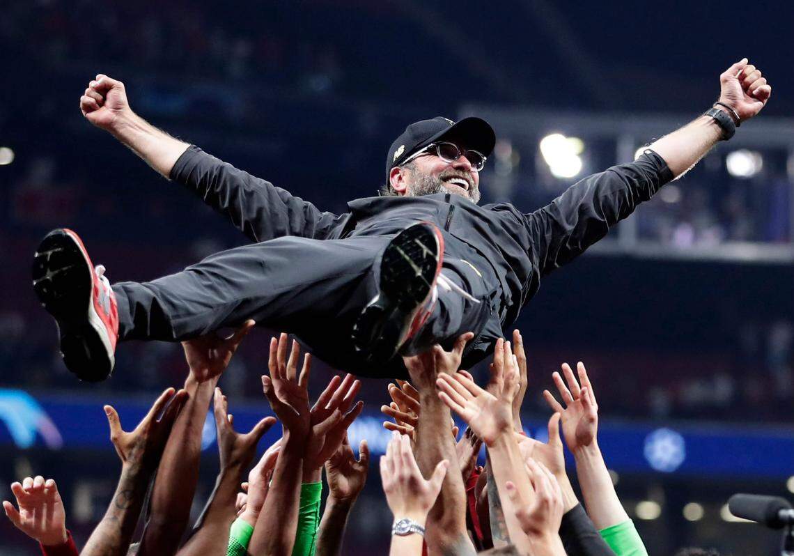 Liverpool coach Jurgen Klopp is thrown into the air by player after winning the Champions League final soccer match between Tottenham Hotspur and Liverpool in 2019. Klopp plans to step down as Liverpool manager at end of this season.