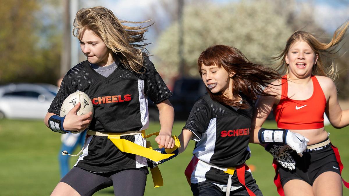 Lauren Ruhter, left, runs the ball during practice April 17 at Settlers Park in Meridian.