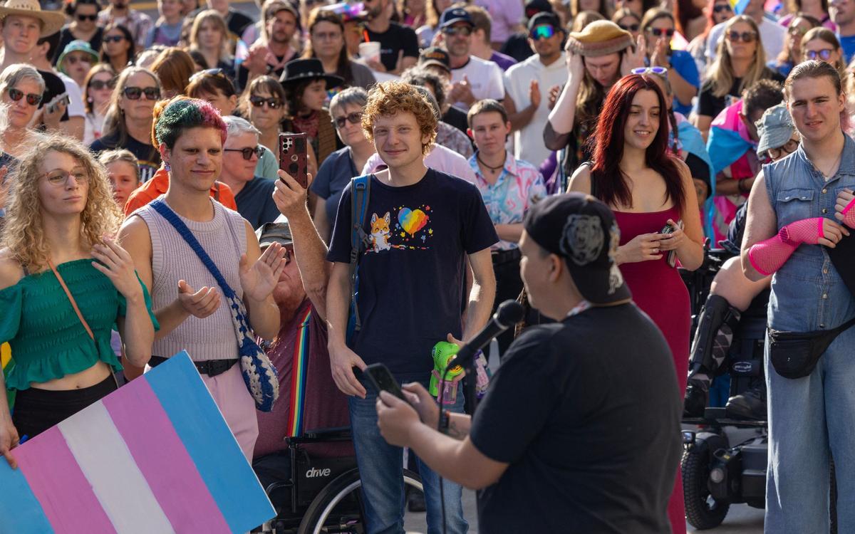 Hundreds of people gather in downtown Boise to listen to speakers before the start of the Trans March in Boise, Friday, Sept. 13, 2024.