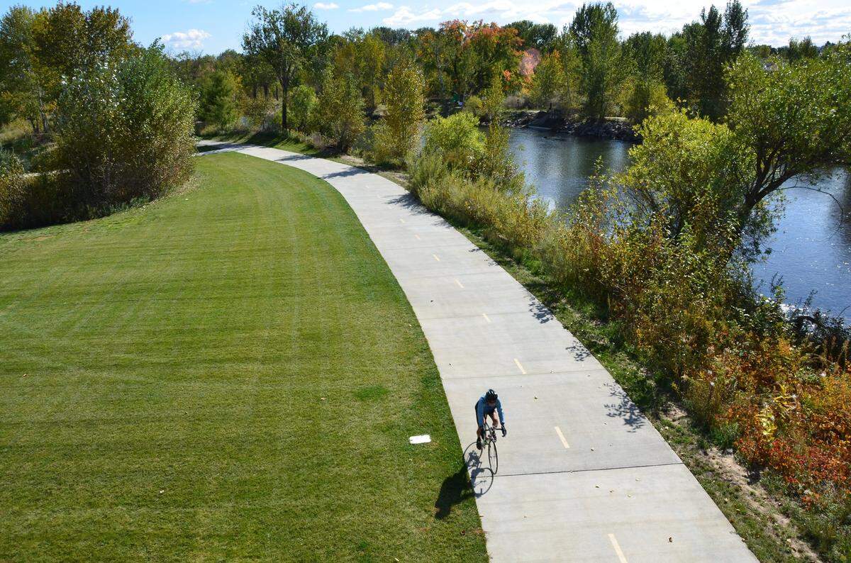 Cyclists love the smooth pathway through Marianne Williams Park in Boise.