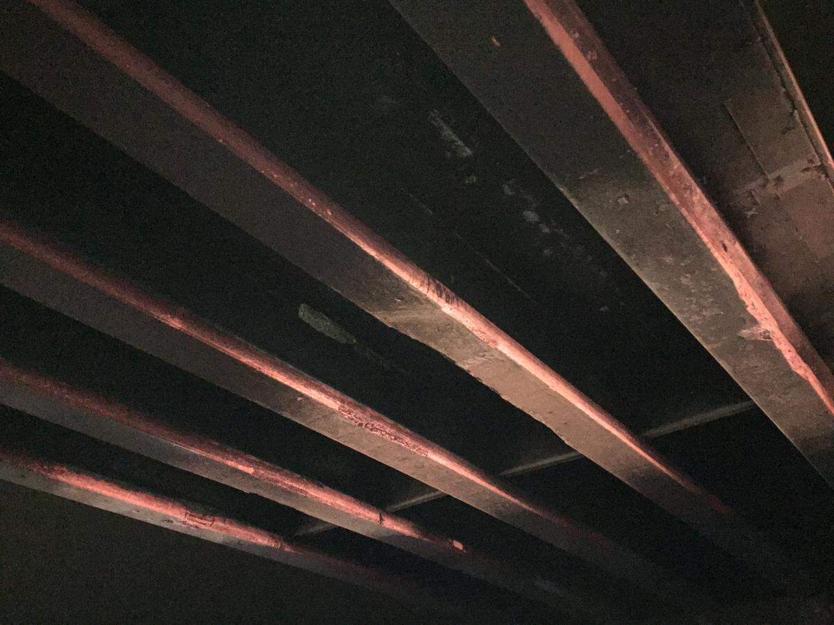 Concrete girders under the Cloverdale overpass, damaged by fire from a deadly crash on June 16, display pink coloration that is a sign of internal damage.